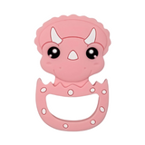 A silicone teether in the shape of a pink dinosaur with a friendly face design, featuring large eyes and a small mouth opening.