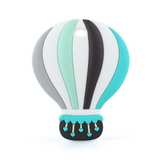 A silicone teether in the shape of a hot air balloon, featuring green, gray and white colors with a basket at the bottom.